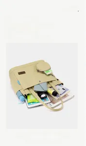 Detailed interior of the beige canvas tote bag showing its large storage capacity