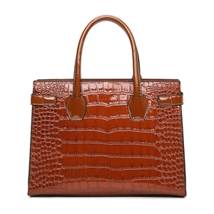 Brown crocodile embossed tote bag with structured design and polished finish