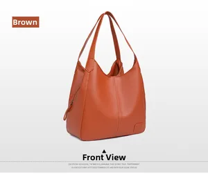 Detailed view of brown tote bag with premium lychee grain leather and brand tag