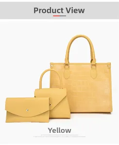Three-piece yellow crocodile pattern bag set with large tote, handbag, and clutch bag