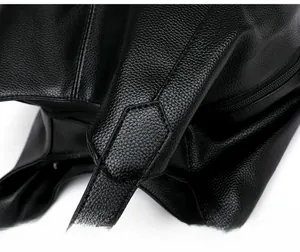 Close-up showing the reinforced stitching and pebble grain texture of the black tote bag