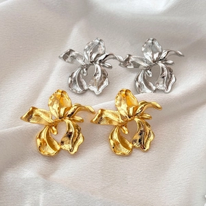 French vintage gold and silver orchid earrings with irregular floral metal texture