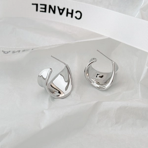 Elegant silver twisted C-shape metal stud earrings with a glossy minimalist finish