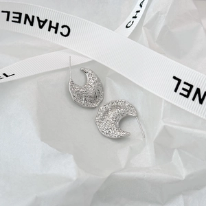 Vintage silver C-shaped chunky stud earrings with textured hammered finish and metallic feel