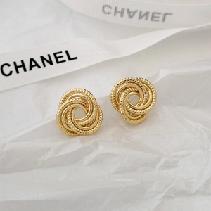 S925 gold-plated irregular geometric twisted knot hoop earrings for women on white background