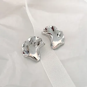 Minimalist irregular wavy liquid silver stud earrings with polished folded texture finish