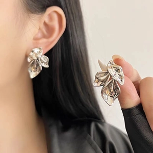 Chic silver-colored oversized leaf stud earrings with organic layered petal design