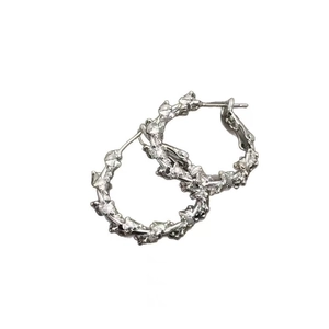Modern silver irregular textured hoop earrings with a unique lava design for women