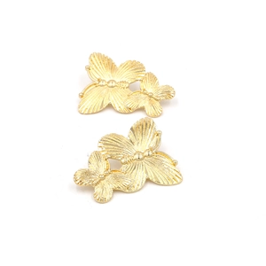 Retro oversized gold butterfly stud earrings with layered wings and engraved metal textures