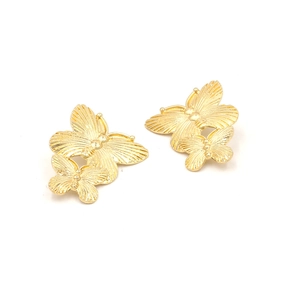 Retro golden butterfly stud earrings with detailed metallic wings on a white background