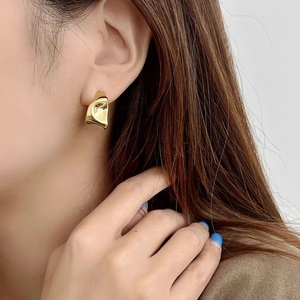 Minimalist golden irregular geometric earrings with liquid metal texture for women