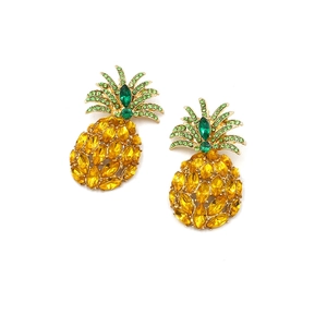 Close-up of pineapple earrings with yellow and green crystals on gold setting
