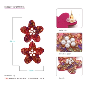 Exaggerated floral acetate earrings with marble texture, acrylic petals, and pearls