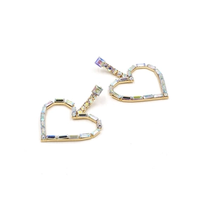 Detail of heart-shaped earrings with colorful crystals in a polished gold-tone frame