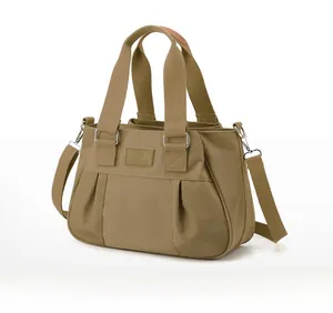 Khaki nylon handbag with pleated front detail, silver hardware and adjustable strap
