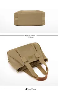 Detail of khaki nylon tote bag showing the reinforced brown leather handle and brand logo