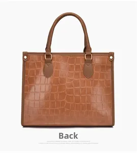 Back view of brown crocodile embossed leather tote bag showing textured finish