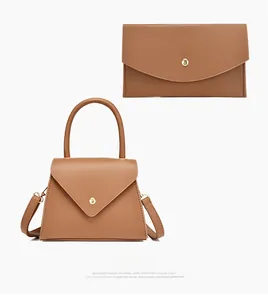 Brown faux leather handbag set featuring a tote bag and matching long wallet with gold hardware