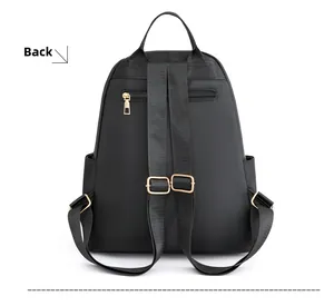 Rear view of black nylon backpack with gold hardware and anti-theft zipper pocket