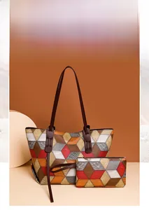Dettaglio della borsa tote a blocchi di colore geometrici e pochette con trama coccodrillo