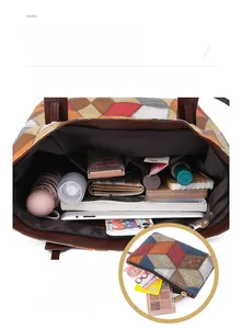 Detailed interior of color-block tote bag showing large capacity and inner pockets