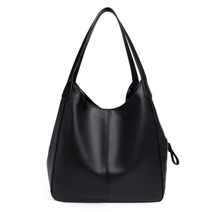 Minimalist black pebbled leather tote bag with large capacity and soft texture for daily use