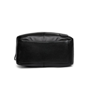 Classic black pebbled leather tote bag with elegant embossed logo on white background