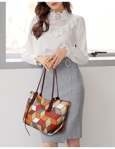 Dettaglio della borsa tote con motivi geometrici colorati e manici in pelle scura