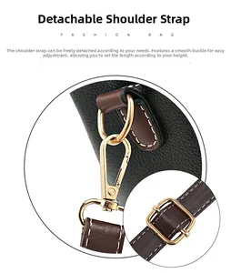 Détail du fermoir mousqueton doré amovible et bandoulière réglable sur sac en cuir noir