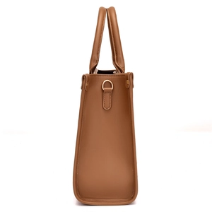 Brown faux leather tote bag with stone texture and side metal D-ring attachment