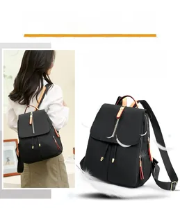 Detail view of water-resistant oxford fabric backpack with stylish metal zipper design