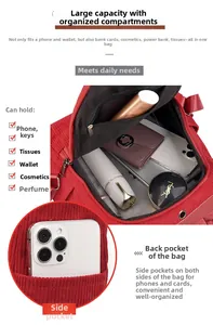 Detailed interior compartment view showing large capacity and side pockets of red corduroy bag