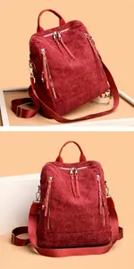 Detailed macro view of retro corduroy fabric texture and silver zippers on a burgundy backpack