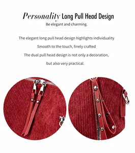 Detail view of burgundy corduroy backpack with double silver zippers and long pullers