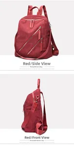 Detail of dark red corduroy backpack showing side pockets and textured fabric surface