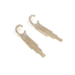 Elegant gold C-shaped earrings with cascading rhinestone tassels in a long fringe design