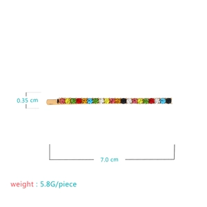 Colorful rhinestone bobby pin with gold metal base and dimensions of 7.0 x 0.35 cm