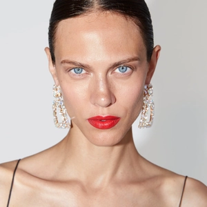 Exaggerated geometric rectangle drop earrings with iridescent rhinestones on model