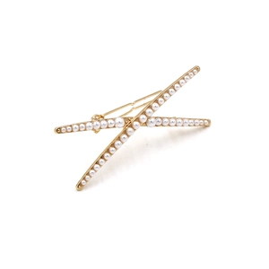 Elegant gold crossover hair clip featuring two rows of delicate white pearls on white background