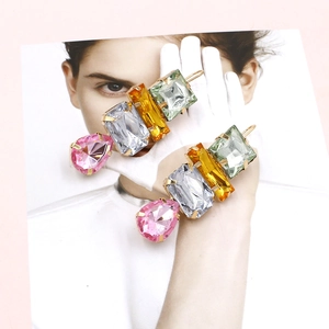 Detailed view of colorful geometric crystal drop earrings with multi-color stones