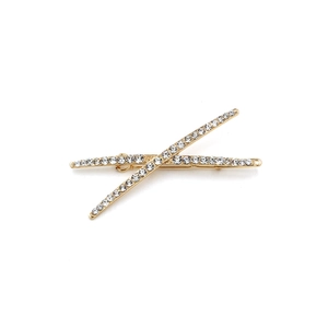 Minimalist gold hair clips with sparkling crystals set in a stylish cross arrangement