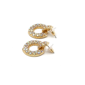 Detailed view of round gold alloy earrings with AB crystal rhinestones and spiral texture
