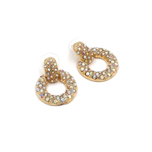 Detail of gold round earrings with twisted metal texture and AB crystal rhinestones