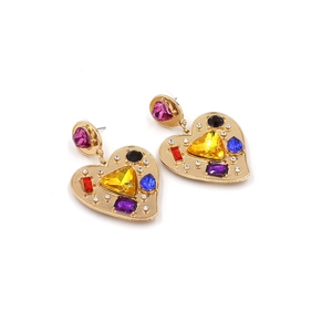 Detailed close-up of retro gold heart earrings with vibrant multi-colored crystal stones