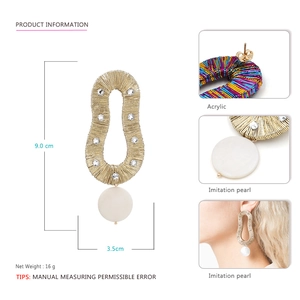 Golden wire wrapped teardrop earrings with large white pearl and sparkling crystals