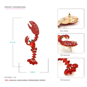 Sparkling rhinestone lobster earrings in gold zinc alloy with dimensions 6.3cm by 2.0cm