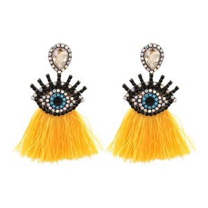 Bohemian evil eye earrings with yellow pear-shaped stones and long silk tassels
