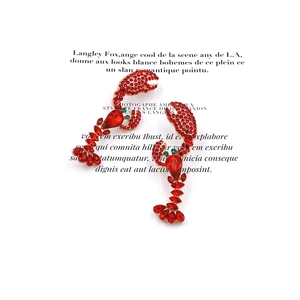 Exaggerated lobster drop earrings with red rhinestones and gold-plated metal base