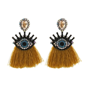 Vintage evil eye tassel earrings with blue rhinestones and mustard yellow fringes