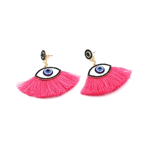 Detail of rose red tassel earrings with crystal evil eye studs and green stones